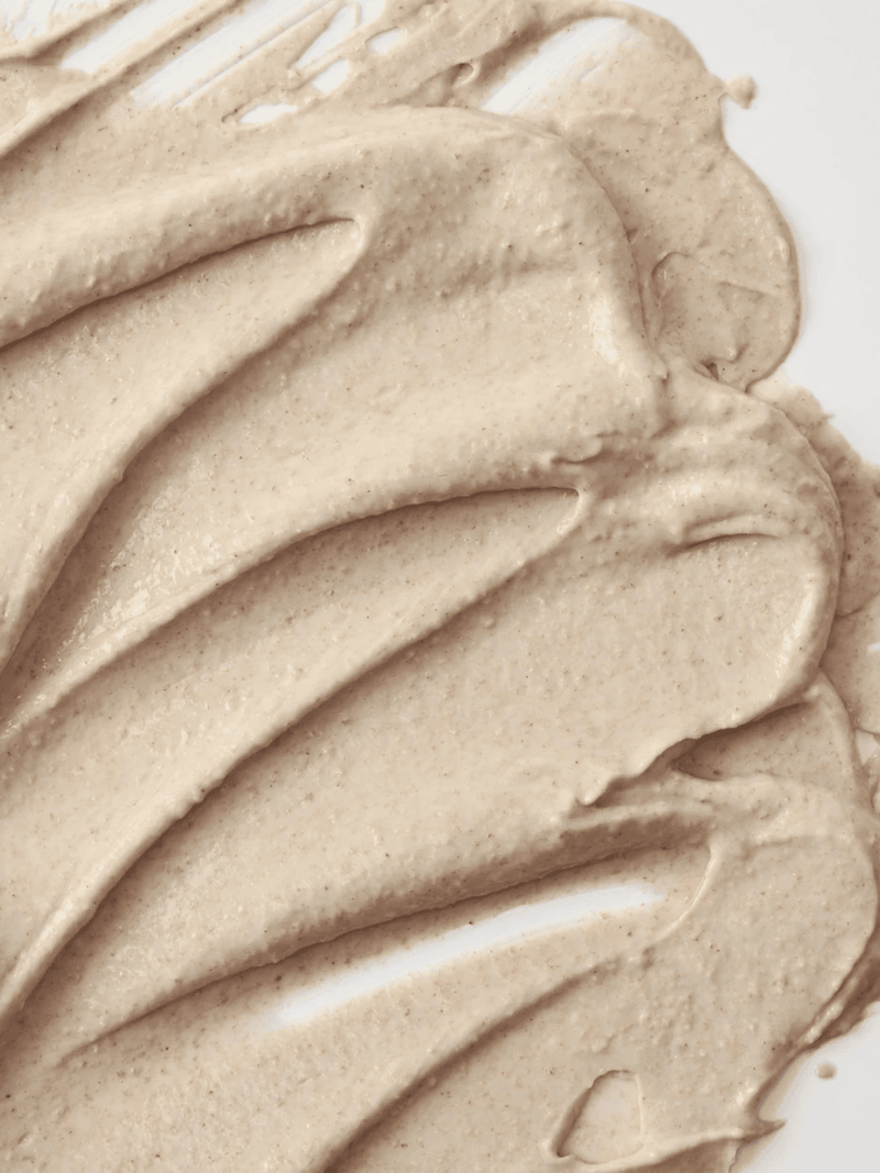 Thick creamy texture with rice hull granules on skin